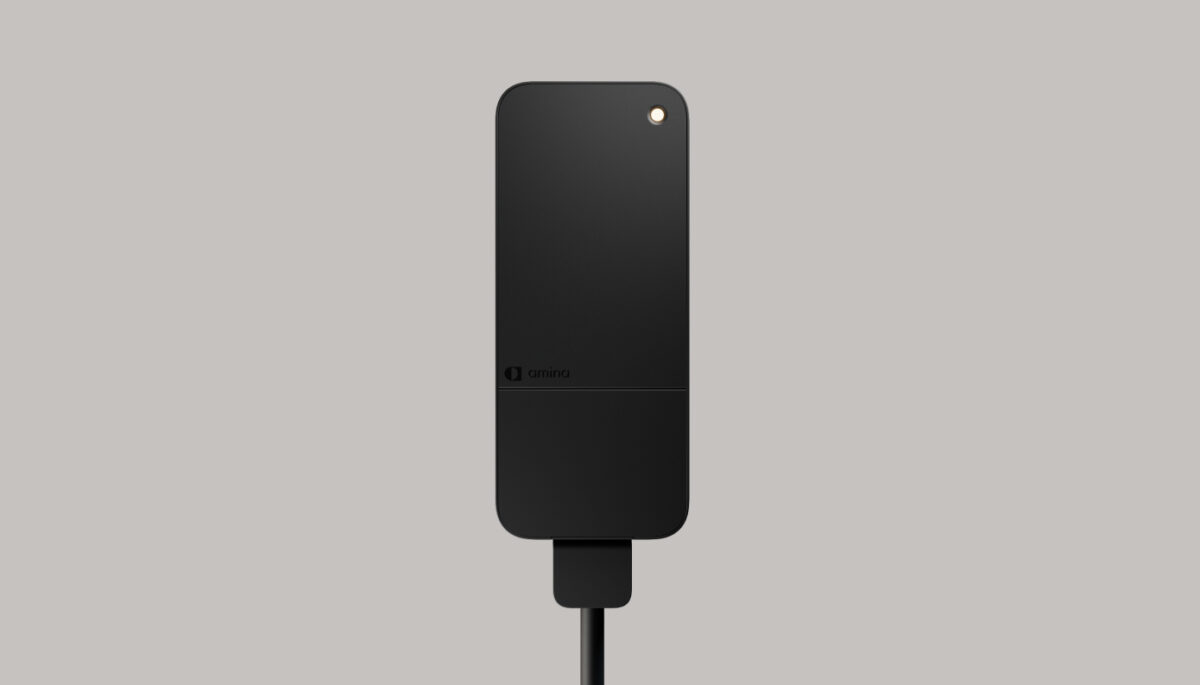 amina S home EV charger in matte black, front-facing product image highlighting compact Scandinavian design, integrated LED indicator and dependable AC charging for residential installations.